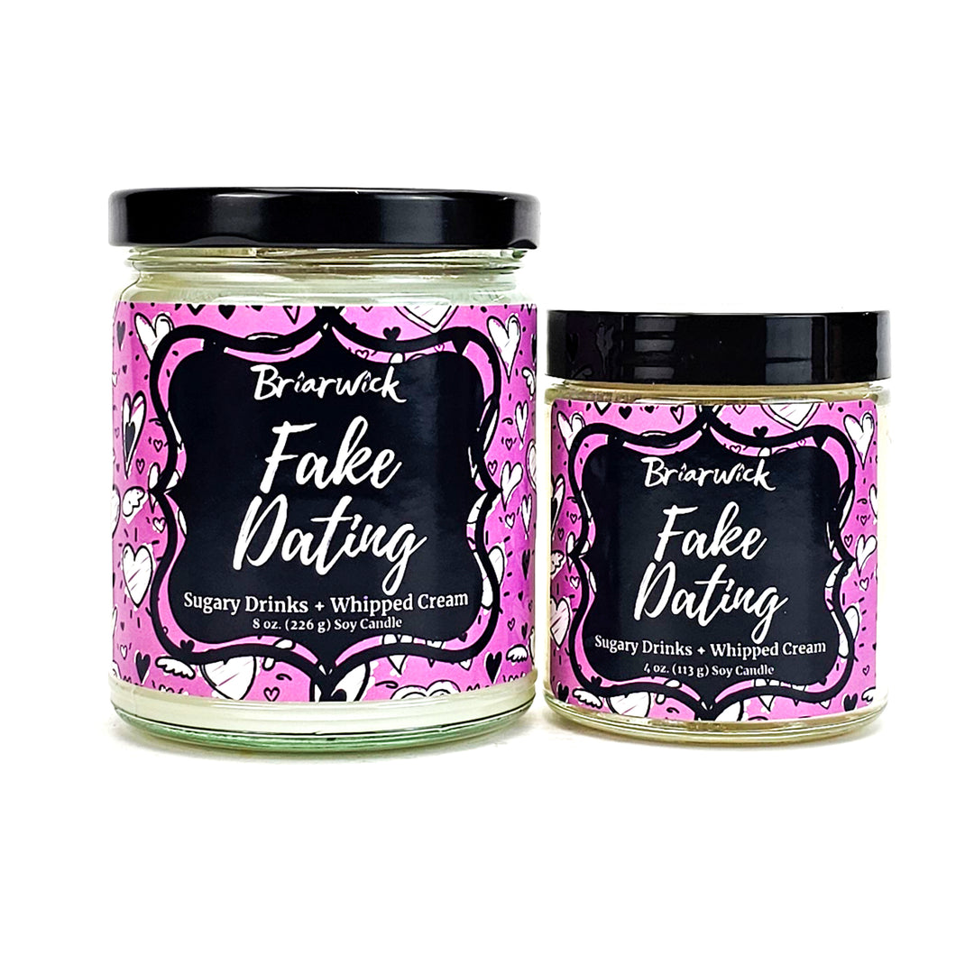 Fake Dating 8oz & 4oz white candles with pink heart designs on a white background