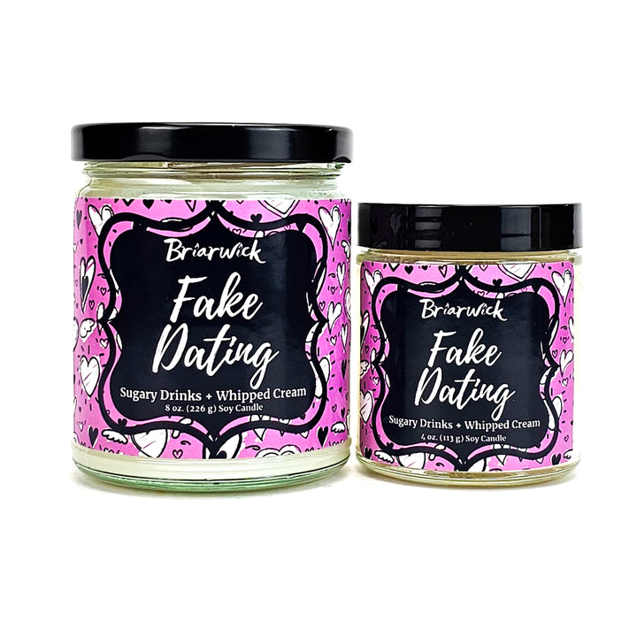 Fake Dating 8oz & 4oz white candles with pink heart designs on a white background