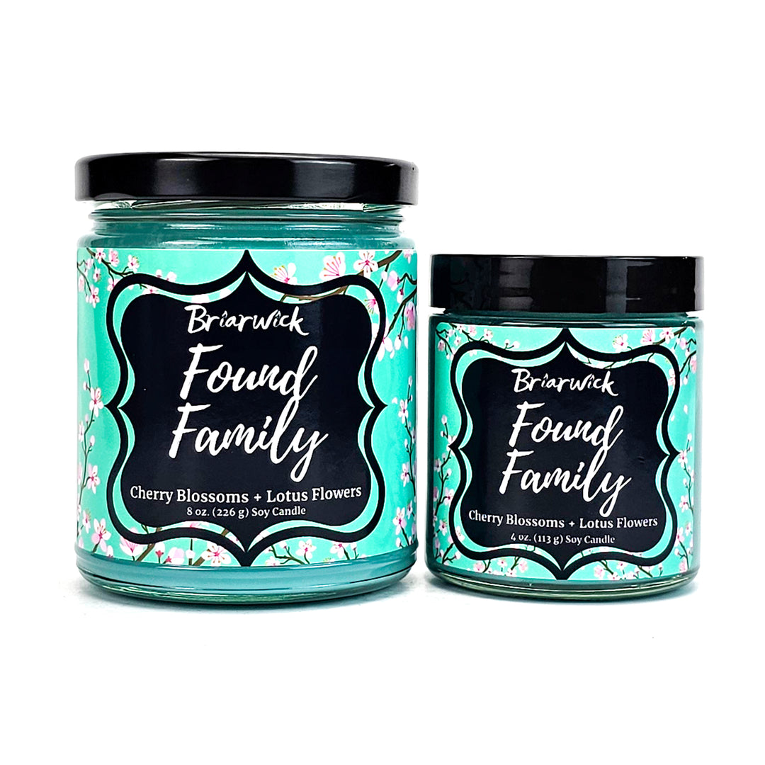 Found Family 8oz & 4oz turquoise candles with turquoise cherry blossom designs on a white background