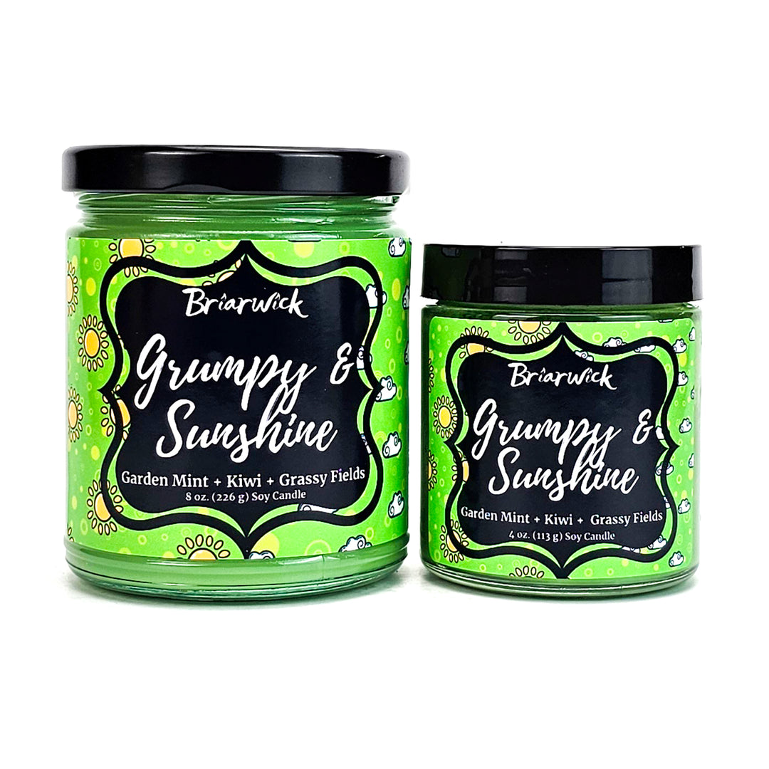 Grumpy & Sunshine 8oz & 4oz lime candles with sunshine/cloud split designs on a white background