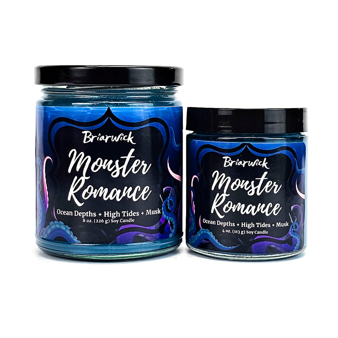 Monster Romance 8oz & 4oz navy candles with blue tentacle designs on a white background