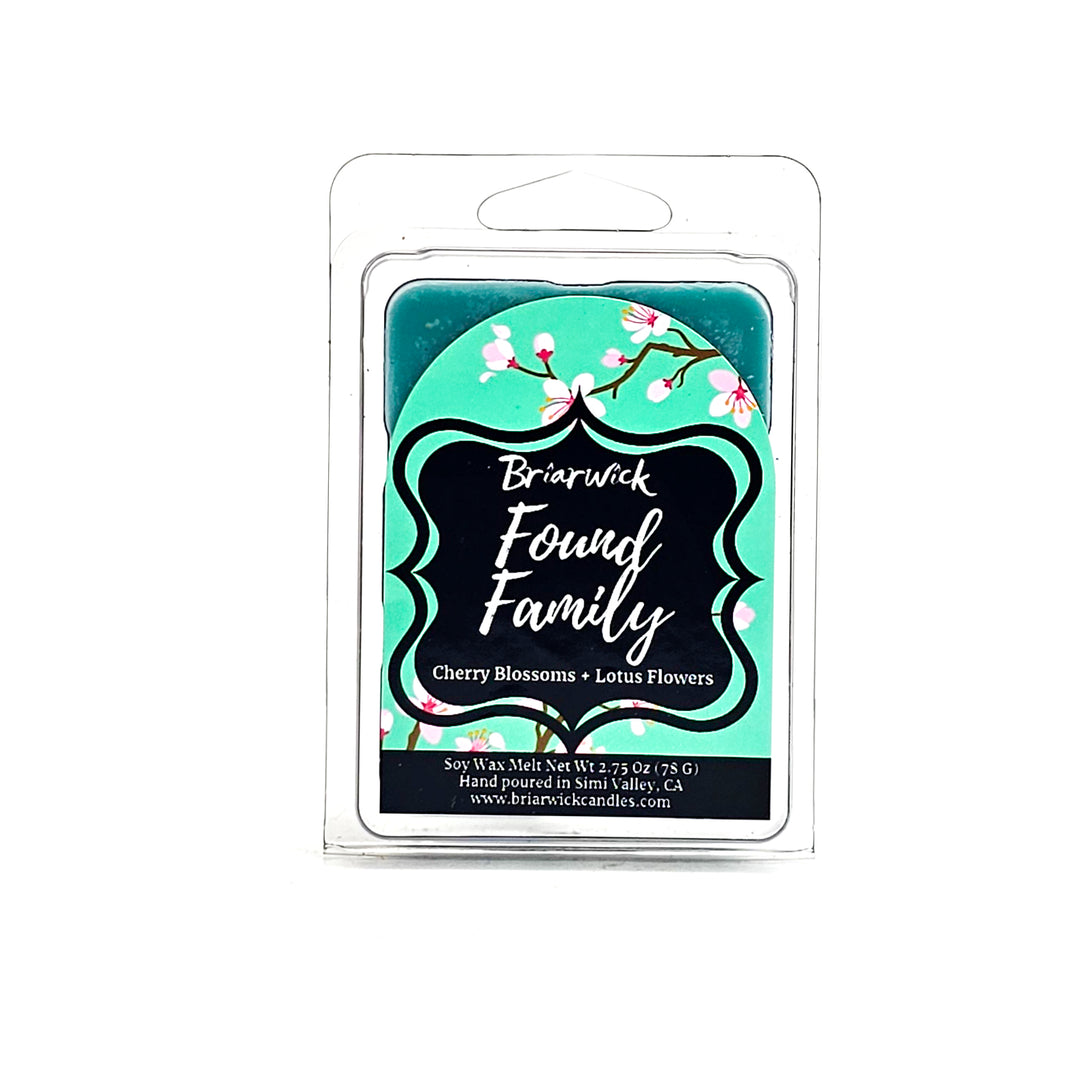 Found Family 2oz turquoise Wax Melt with turquoise cherry blossom design on a white background