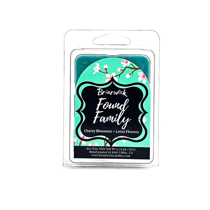 Found Family 2oz turquoise Wax Melt with turquoise cherry blossom design on a white background