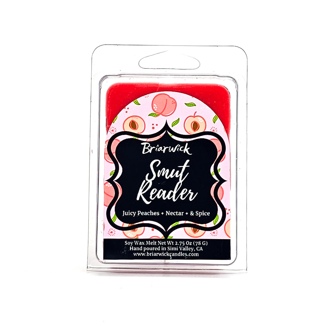Smut Reader 2oz dark peach Wax Melt with pink peach design on a white background