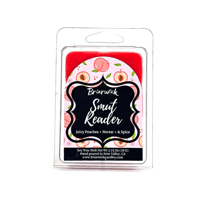 Smut Reader 2oz dark peach Wax Melt with pink peach design on a white background