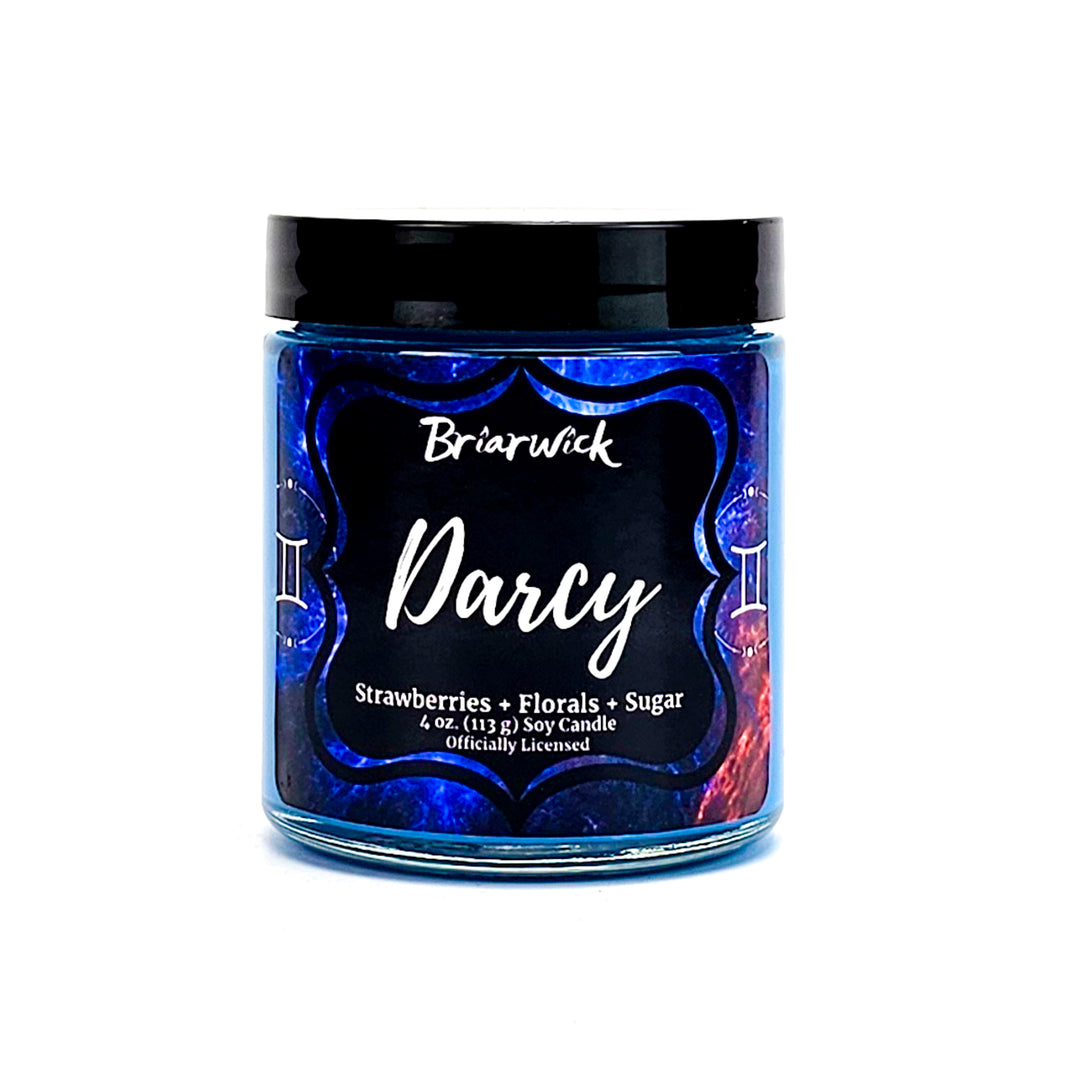 Darcy 4oz cerulean candle with blue galaxy gemini design on a white background