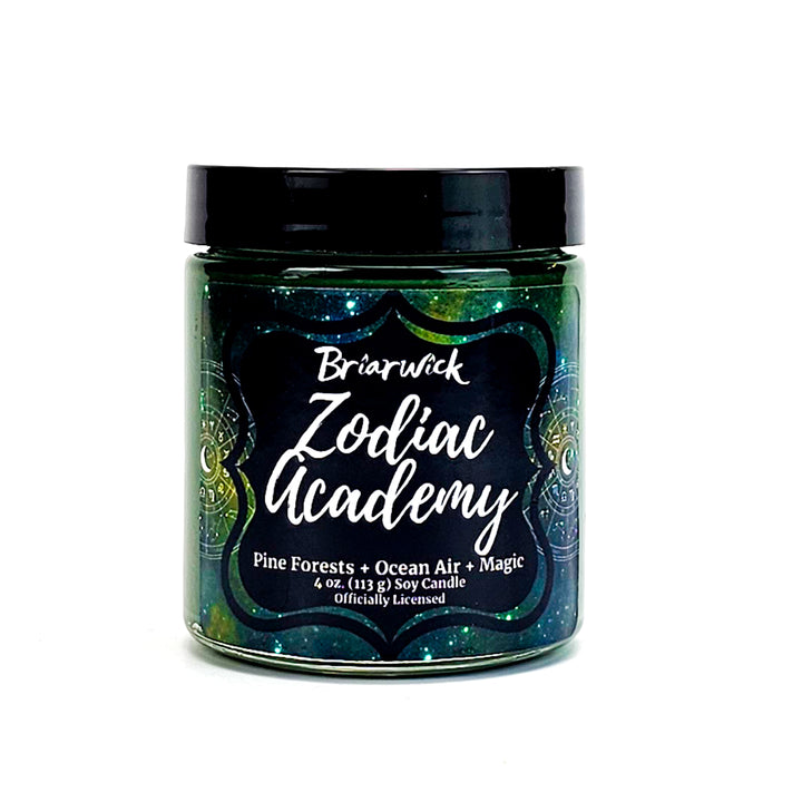 Zodiac Academy 4oz pine green candle with green galaxy star chart design on a white background