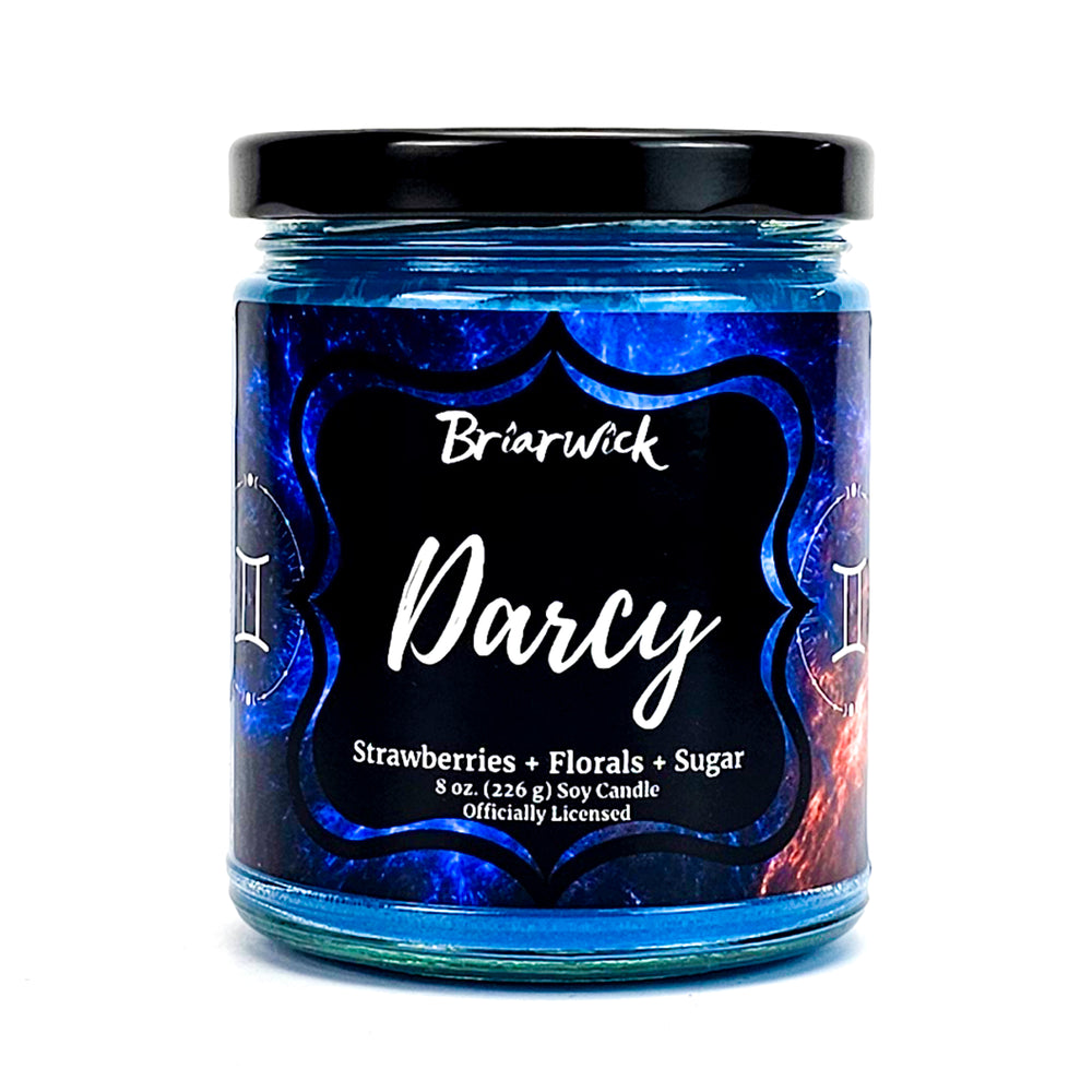 Darcy 8oz cerulean candle with blue galaxy gemini design on a white background
