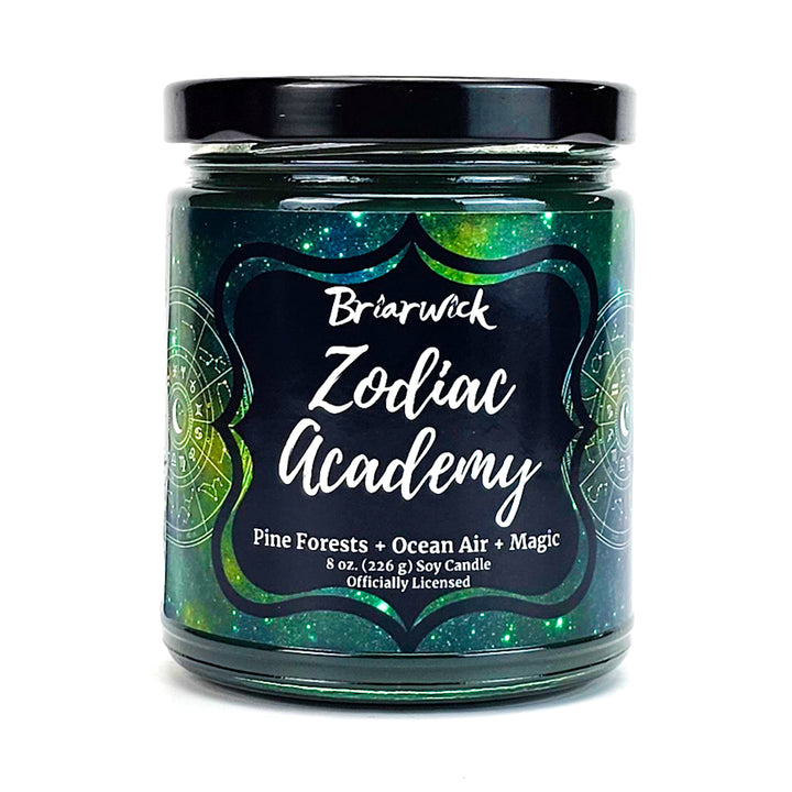 Zodiac Academy 8oz pine green candle with green galaxy star chart design on a white background