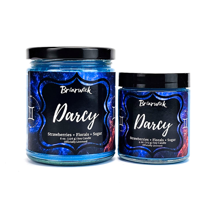 Darcy 8oz & 4oz cerulean candles with blue galaxy gemini designs on a white background