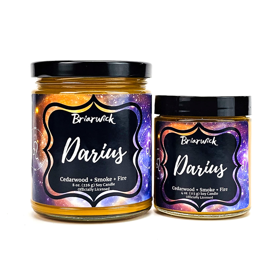 Darius 8oz & 4oz mustard yellow candles with yellow galaxy leo designs on a white background