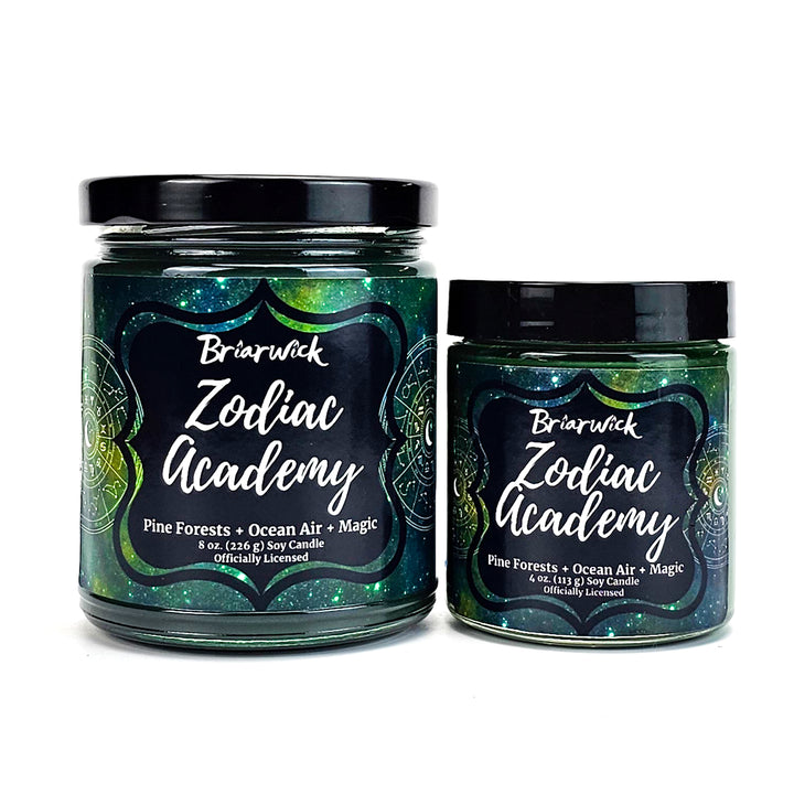 Zodiac Academy 8oz & 4oz pine green candles with green galaxy star chart designs on a white background